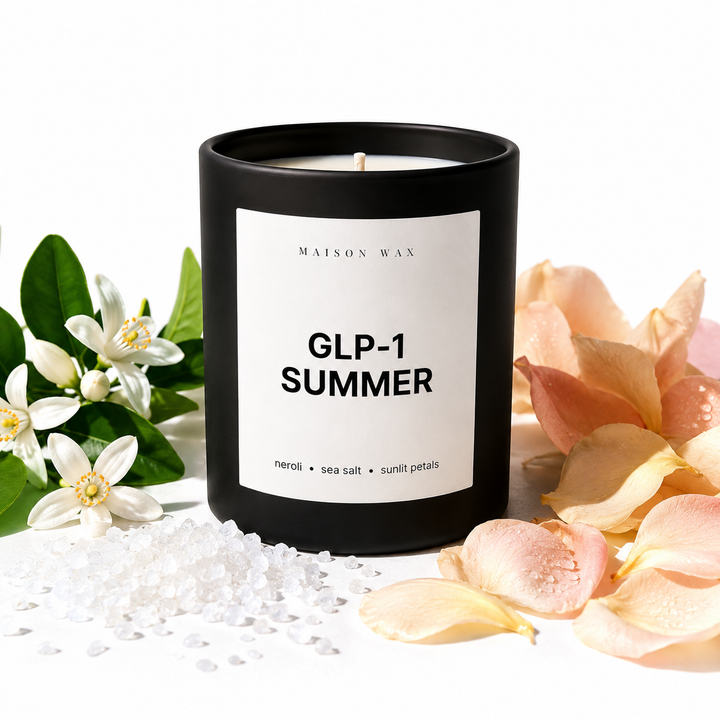 Maison Wax 'GLP-1 Summer' candle styled with neroli, sea salt, and petals.