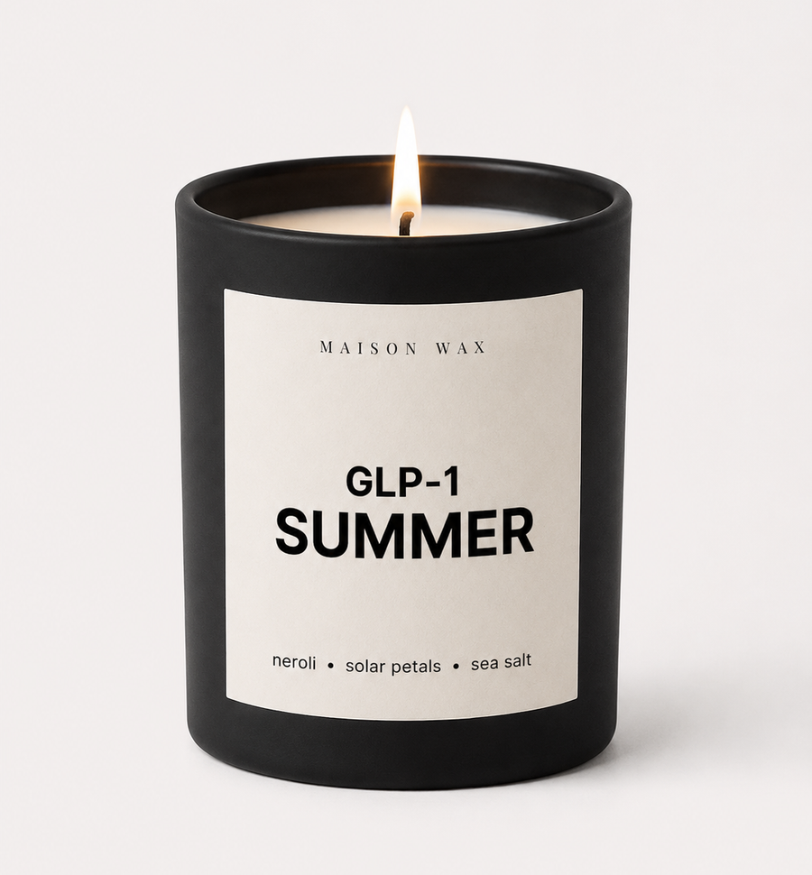 Maison Wax 'GLP-1 Summer' candle, lit, with neroli, solar petals, and sea salt scent notes.