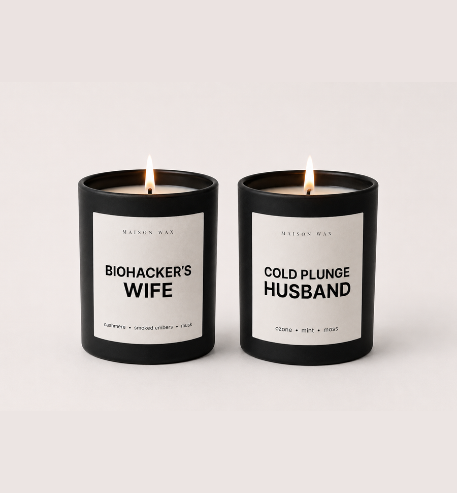 Maison Wax His & Hers candle set - Biohacker's Wife and Cold Plunge Husband candles, both lit.