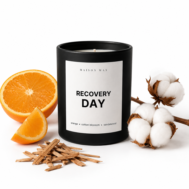 Maison Wax 'Recovery Day' candle styled with orange, cotton, and sandalwood.