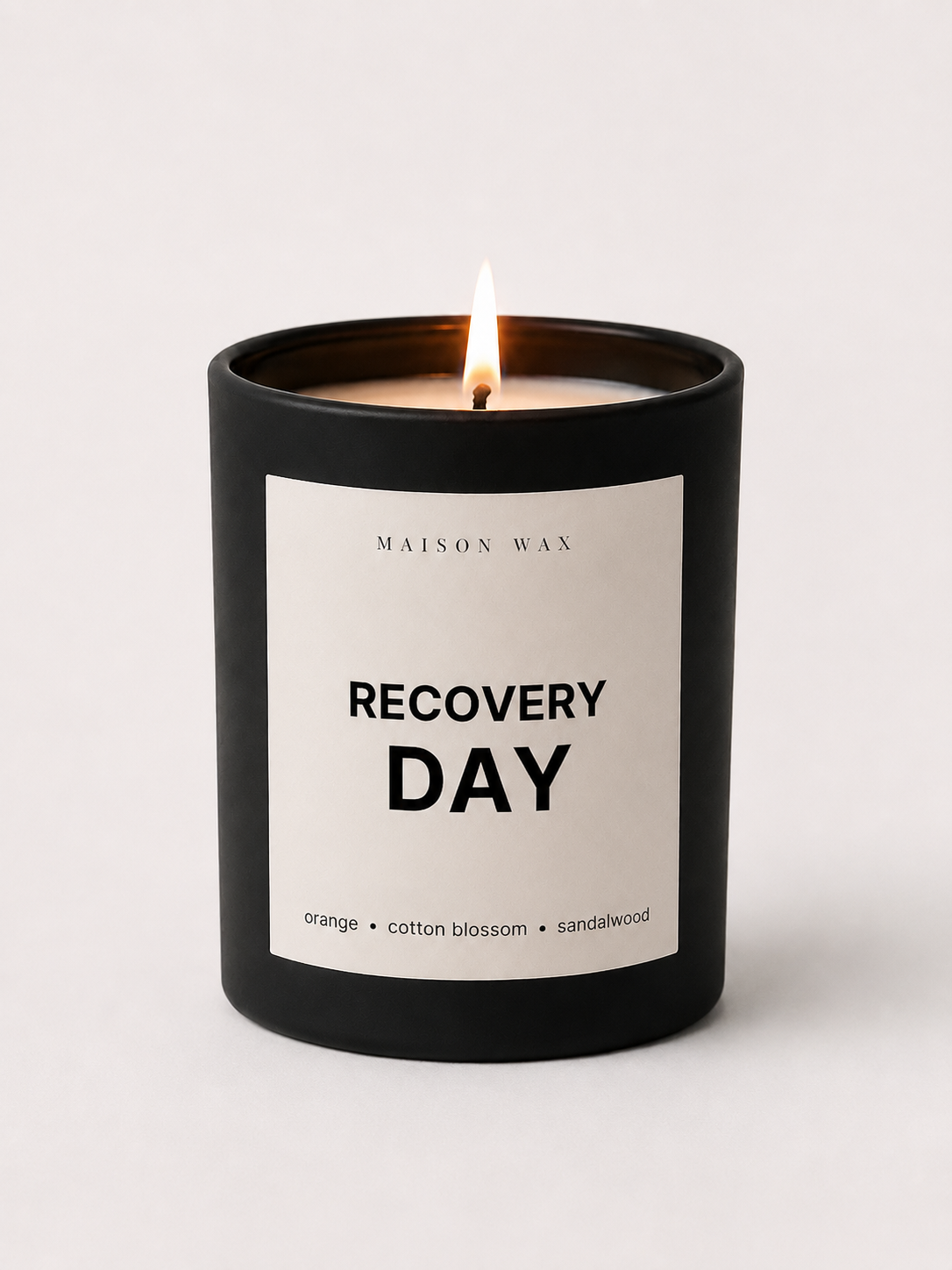Maison Wax 'Recovery Day' candle with orange, cotton blossom, and sandalwood scent notes.